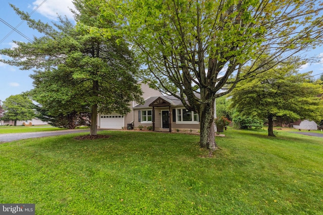 5939 Meadow Rd, Frederick, MD 21701 - view of property hidden behind natural elements with driveway, a garage, and a front lawn