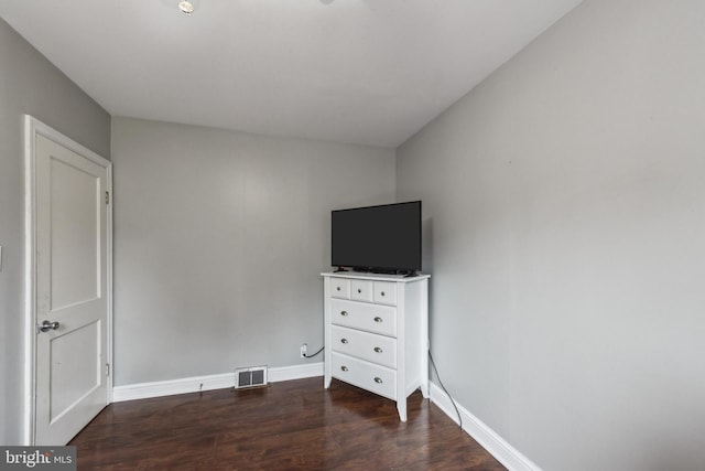 5939 Meadow Rd, Frederick, MD 21701 - unfurnished bedroom featuring dark wood-style flooring and baseboards