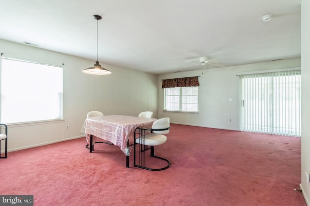 206 Holiday City Blvd, Williamstown, NJ 08094 - dining area featuring carpet floors, visible vents, a ceiling fan, and baseboards