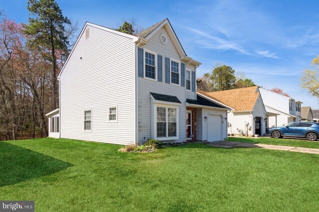 206 Holiday City Blvd, Williamstown, NJ 08094 - traditional home featuring concrete driveway, an attached garage, and a front lawn