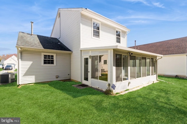 206 Holiday City Blvd, Williamstown, NJ 08094 - back of house with a sunroom, a yard, roof with shingles, and central AC unit