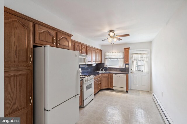 17 Hyannis St, Toms River, NJ 08757 - kitchen featuring backsplash, dark countertops, white appliances, a baseboard heating unit, and ceiling fan