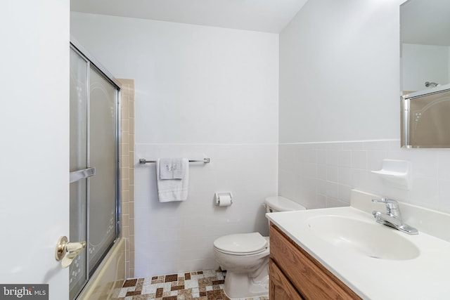17 Hyannis St, Toms River, NJ 08757 - full bath featuring toilet, vanity, a wainscoted wall, and tile walls