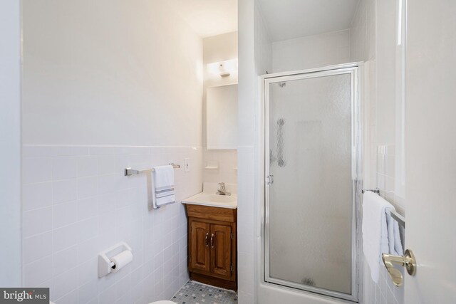 17 Hyannis St, Toms River, NJ 08757 - bathroom with a shower stall, vanity, a wainscoted wall, and tile walls