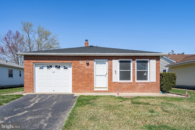 17 Hyannis St, Toms River, NJ 08757 - view of front of property with a chimney, aphalt driveway, brick siding, a front yard, and a garage