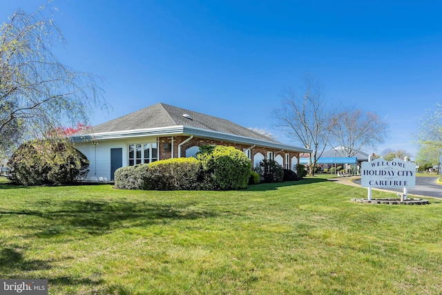 17 Hyannis St, Toms River, NJ 08757 - exterior space with a lawn, brick siding, and a shingled roof