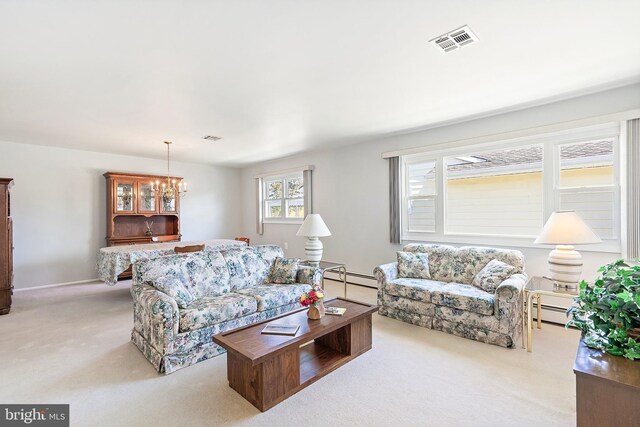 17 Hyannis St, Toms River, NJ 08757 - living area with light colored carpet, a baseboard heating unit, and visible vents