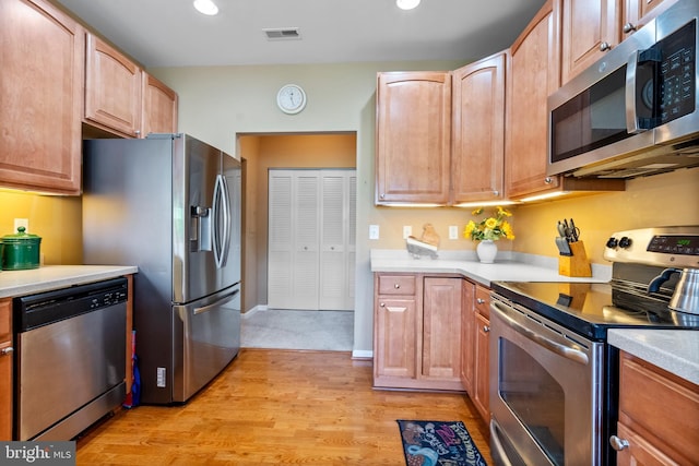 207 Secretariat Dr Unit M, Havre De Grace, MD 21078 - kitchen featuring appliances with stainless steel finishes, light countertops, light wood-style floors, and recessed lighting