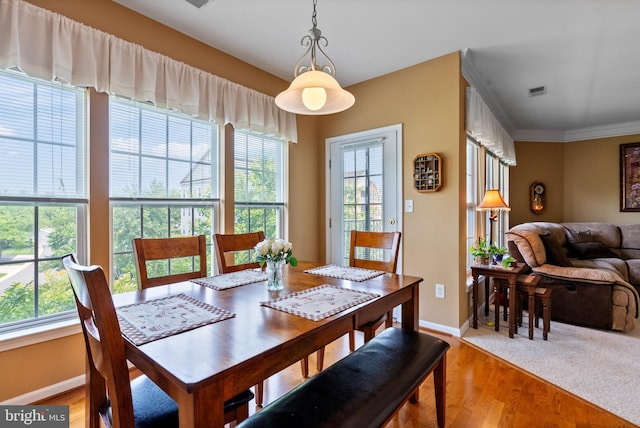 207 Secretariat Dr Unit M, Havre De Grace, MD 21078 - dining space with baseboards, light wood-style flooring, and ornamental molding