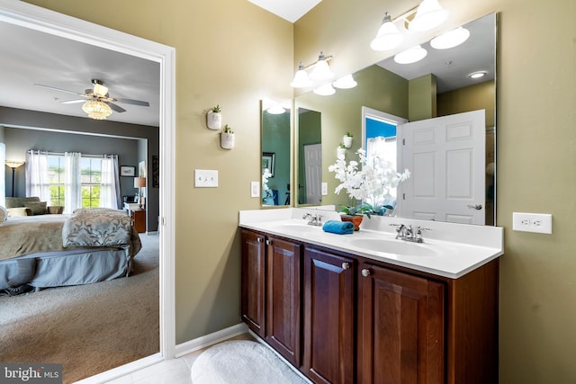 207 Secretariat Dr Unit M, Havre De Grace, MD 21078 - bathroom with double vanity, ensuite bath, a ceiling fan, tile patterned flooring, and baseboards