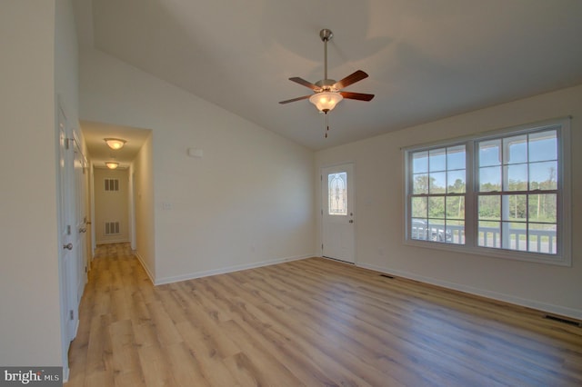 unfurnished room featuring ceiling fan, visible vents, light wood-type flooring, and baseboards