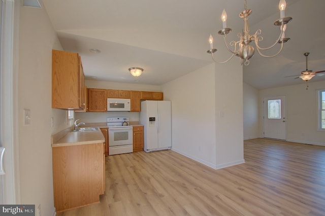 kitchen with light wood-style floors, white appliances, light countertops, open floor plan, and ceiling fan with notable chandelier