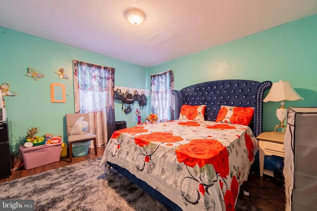 bedroom with wood finished floors