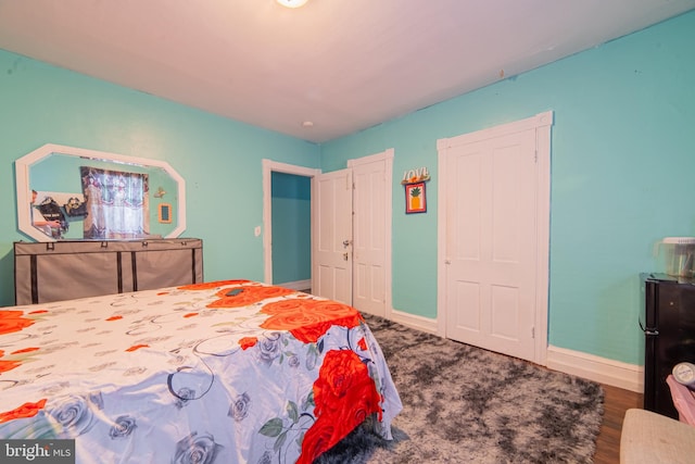 bedroom featuring baseboards