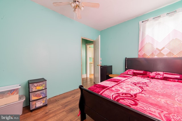 bedroom with wood finished floors and ceiling fan