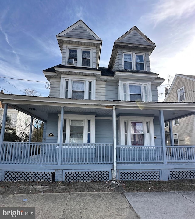 victorian-style house with a porch