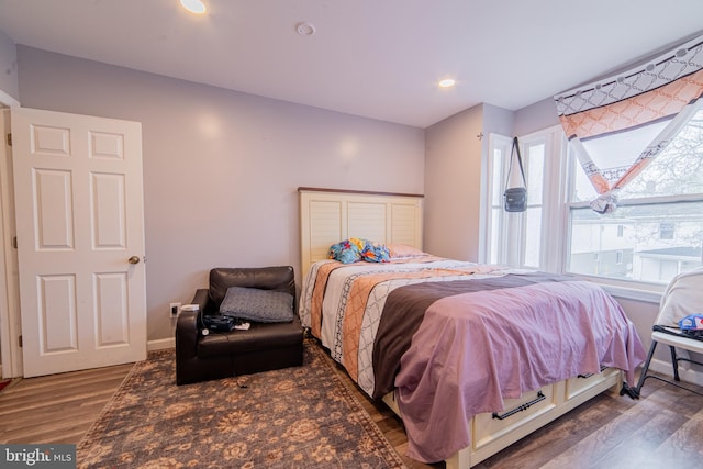bedroom featuring recessed lighting, baseboards, and wood finished floors