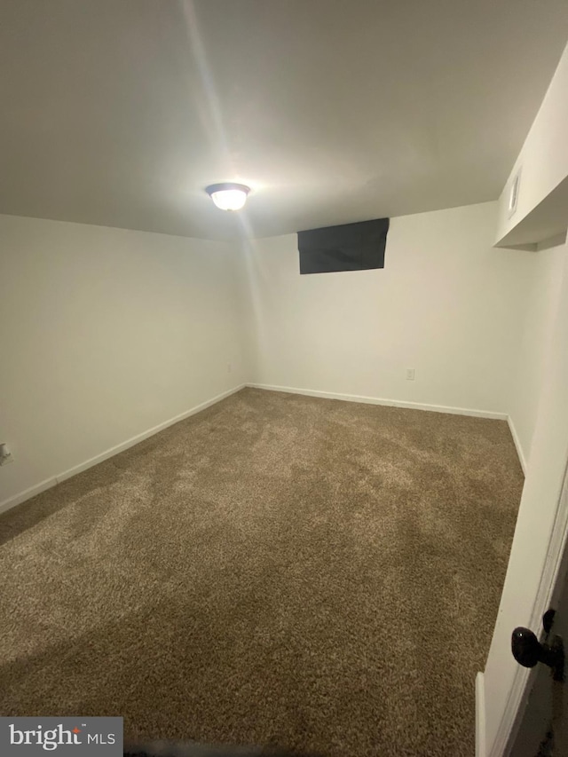 2205 Oak Glen Way, District Heights, MD 20747 - finished basement featuring dark colored carpet and baseboards