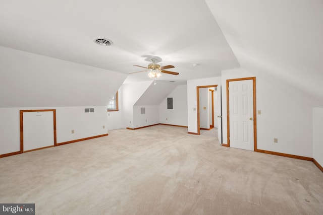 bonus room featuring light colored carpet, a ceiling fan, and visible vents