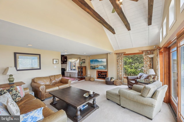 living area featuring beamed ceiling, carpet, and high vaulted ceiling