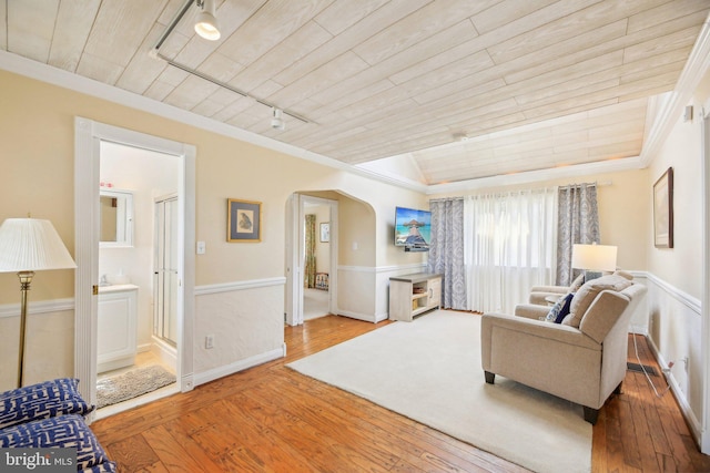 living room with wooden ceiling, track lighting, arched walkways, and wood-type flooring