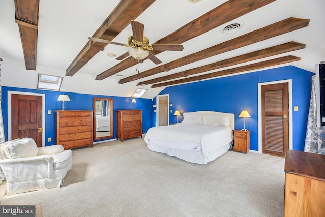 carpeted bedroom with beam ceiling, a ceiling fan, baseboards, and visible vents
