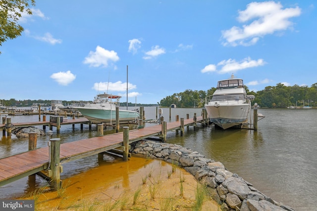 view of dock with boat lift and a water view