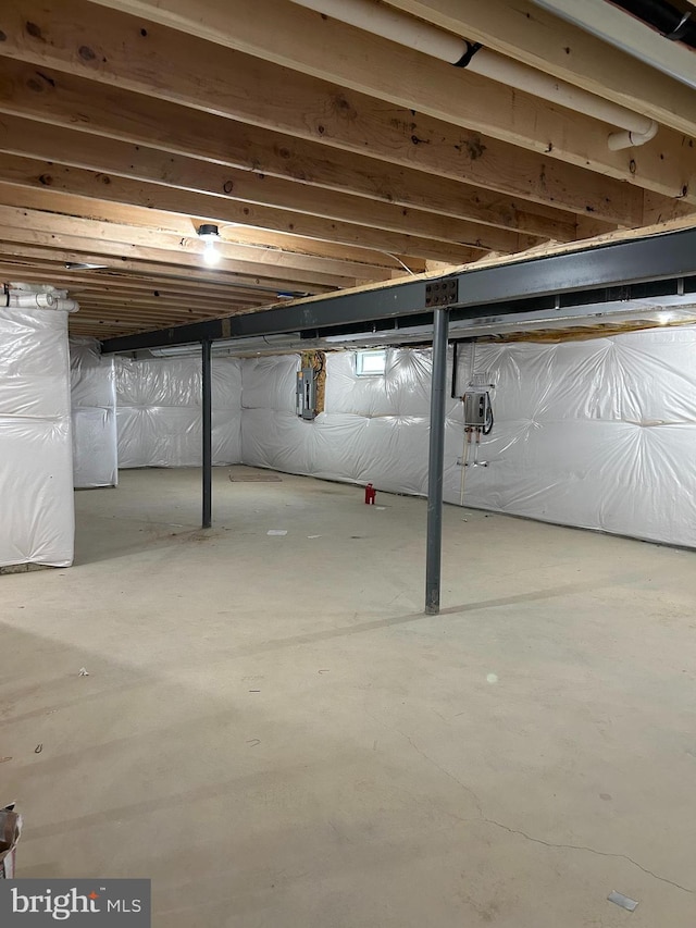 unfinished below grade area with electric panel