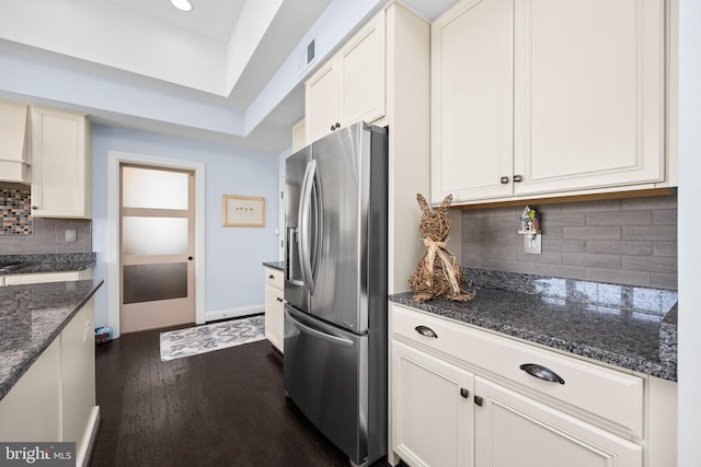 34851 Surfsong Lndg, Millville, DE 19967 - kitchen featuring backsplash, dark wood finished floors, stainless steel refrigerator with ice dispenser, and dark stone counters
