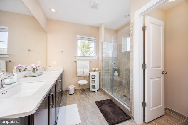 34851 Surfsong Lndg, Millville, DE 19967 - full bath with double vanity, baseboards, a stall shower, and a sink