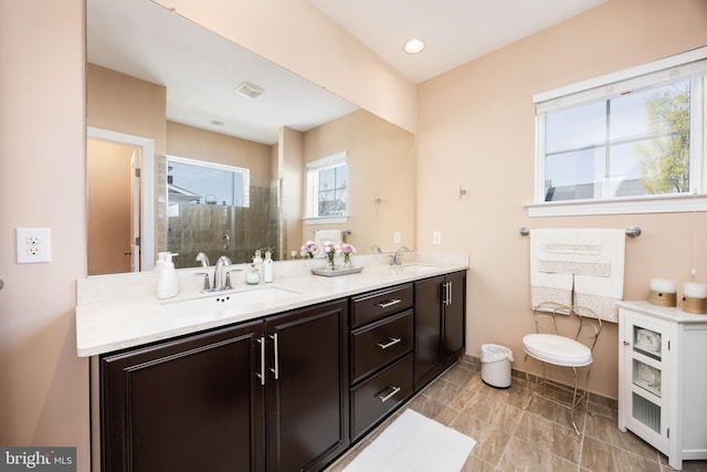 34851 Surfsong Lndg, Millville, DE 19967 - full bath with baseboards, a sink, a shower stall, and double vanity