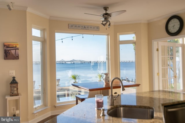 520 Bayside Dr, Stevensville, MD 21666 - kitchen featuring stainless steel dishwasher, crown molding, a sink, and a water view