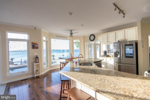 520 Bayside Dr, Stevensville, MD 21666 - kitchen featuring dark wood-style flooring, crown molding, stainless steel appliances, and a sink