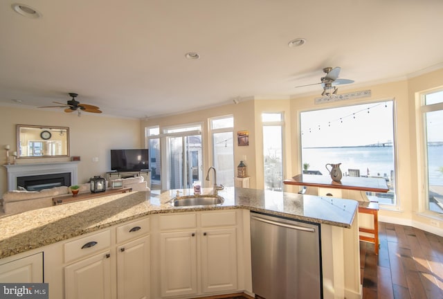 520 Bayside Dr, Stevensville, MD 21666 - kitchen featuring stainless steel dishwasher, a sink, open floor plan, ceiling fan, and ornamental molding