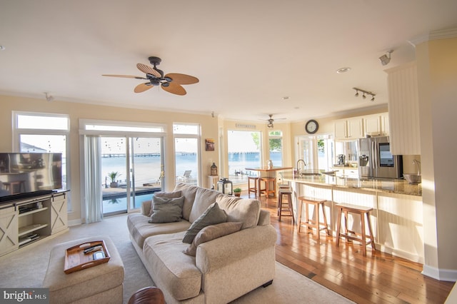 520 Bayside Dr, Stevensville, MD 21666 - living area featuring a water view, ornamental molding, light wood-style floors, and ceiling fan