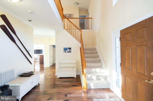 520 Bayside Dr, Stevensville, MD 21666 - foyer featuring stairway, hardwood / wood-style flooring, and crown molding