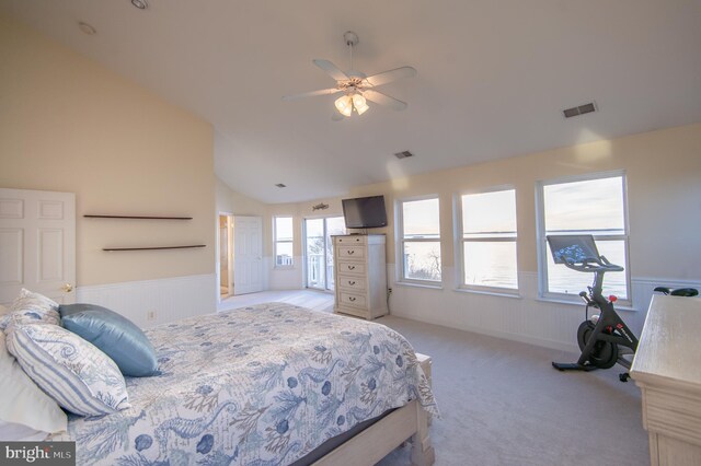 520 Bayside Dr, Stevensville, MD 21666 - bedroom featuring vaulted ceiling, a wainscoted wall, visible vents, and light carpet