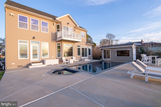 520 Bayside Dr, Stevensville, MD 21666 - back of property featuring an outdoor pool, an outbuilding, a patio area, and a balcony
