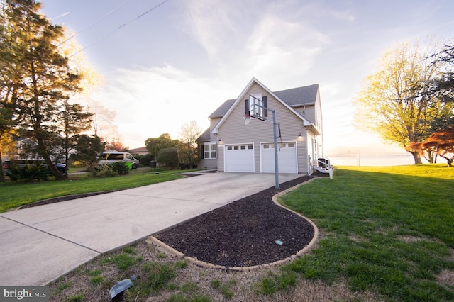 520 Bayside Dr, Stevensville, MD 21666 - view of side of home with an attached garage, driveway, and a yard