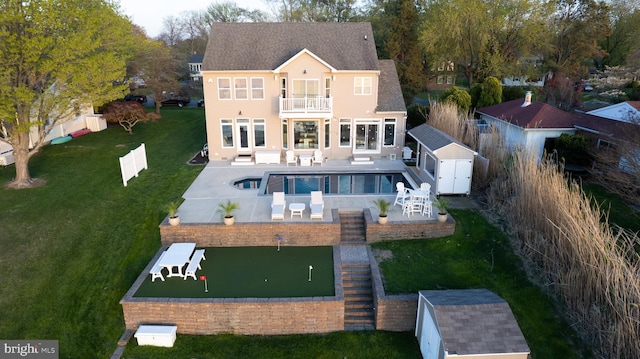 520 Bayside Dr, Stevensville, MD 21666 - back of house with a storage shed, a patio area, a balcony, an outdoor structure, and an outdoor living space