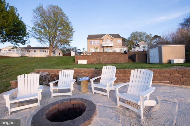 520 Bayside Dr, Stevensville, MD 21666 - view of patio with an outdoor fire pit, a storage unit, and an outdoor structure