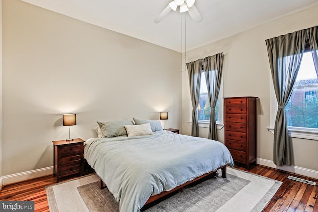 268 S E Ave, Baltimore, MD 21224 - bedroom featuring multiple windows, wood finished floors, and ceiling fan