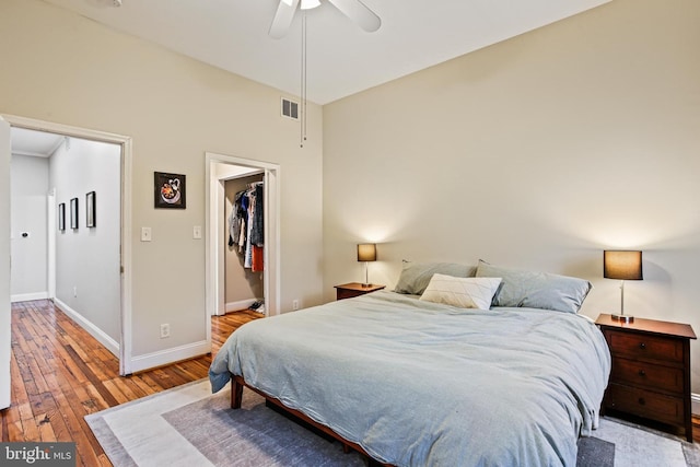 268 S E Ave, Baltimore, MD 21224 - bedroom with hardwood / wood-style flooring, a walk in closet, ceiling fan, and a closet