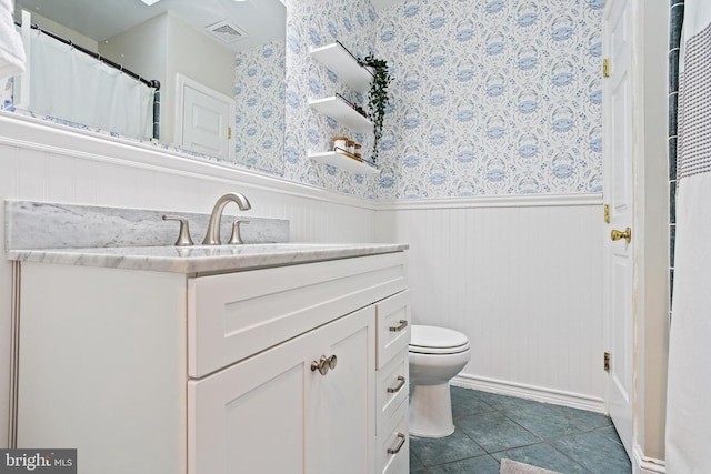 268 S E Ave, Baltimore, MD 21224 - full bathroom with vanity, wainscoting, wallpapered walls, and tile patterned floors