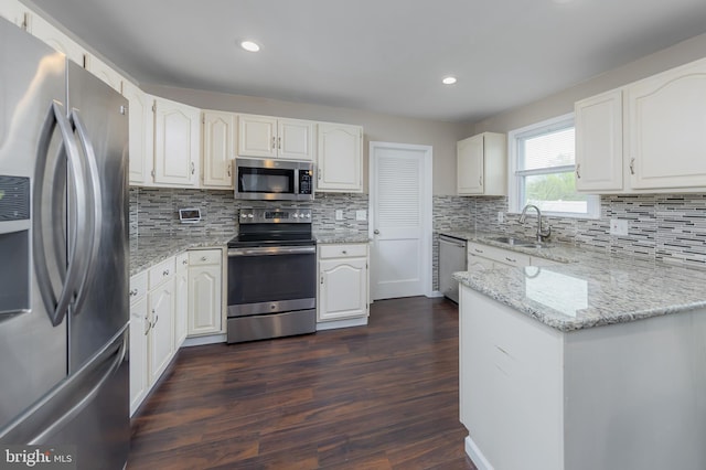119 Field, Penns Grove, NJ 08069 - kitchen featuring white cabinetry, a sink, dark wood-type flooring, and appliances with stainless steel finishes