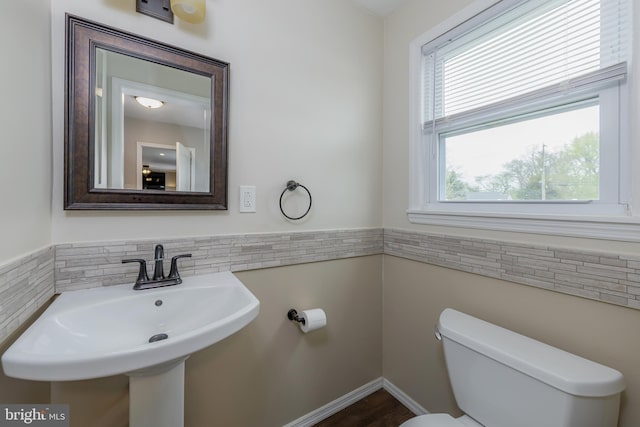 119 Field, Penns Grove, NJ 08069 - bathroom featuring wainscoting, toilet, a sink, and tile walls