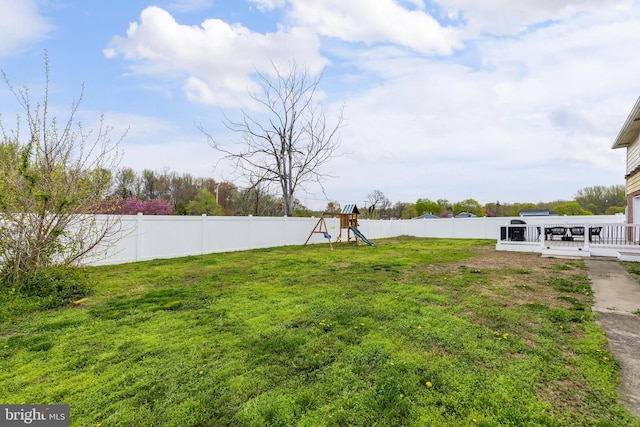 119 Field, Penns Grove, NJ 08069 - view of yard with a fenced backyard, a deck, and a playground