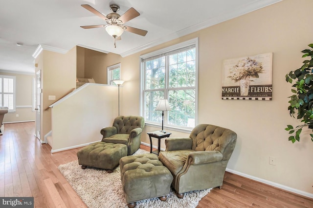 11431 Heritage Commons Way, Reston, VA 20194 - living area with ornamental molding, baseboards, wood finished floors, ceiling fan, and stairway