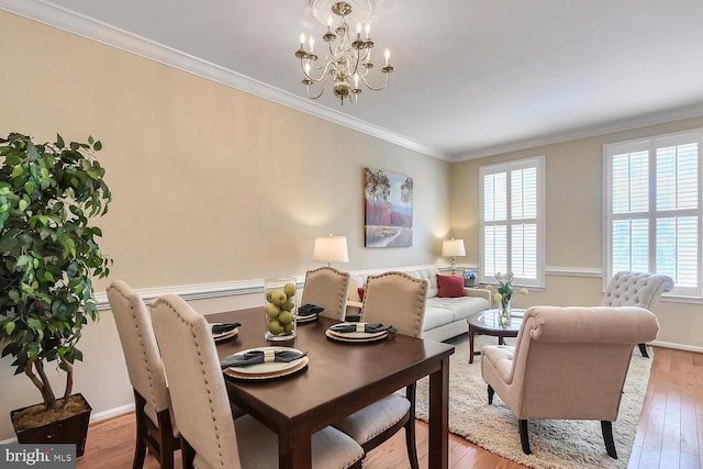 11431 Heritage Commons Way, Reston, VA 20194 - living room featuring crown molding, a chandelier, wood finished floors, and baseboards