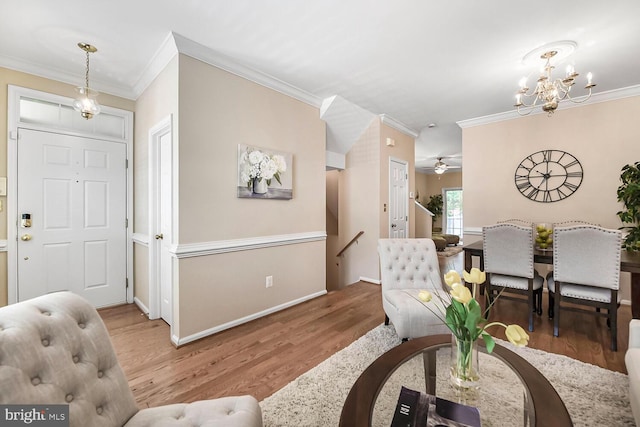 11431 Heritage Commons Way, Reston, VA 20194 - foyer featuring wood finished floors, crown molding, a chandelier, baseboards, and ceiling fan